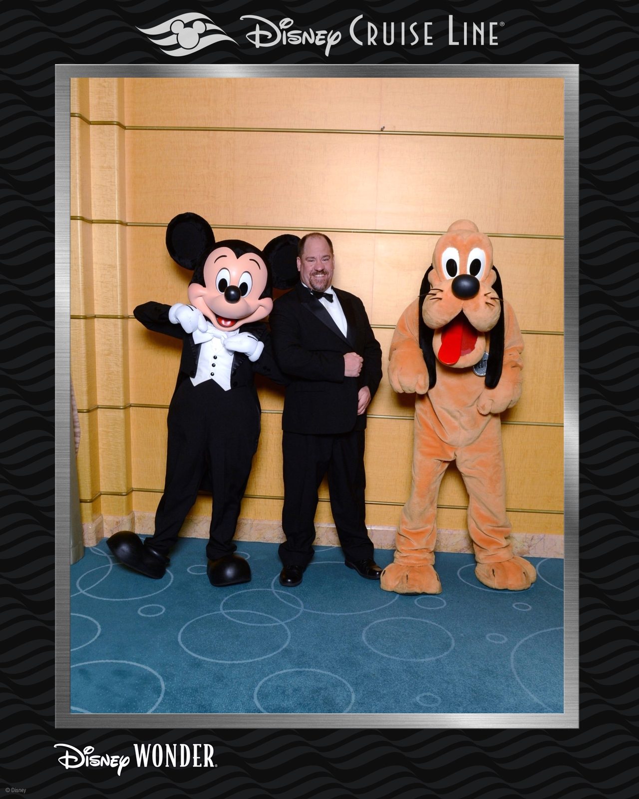 A formal-night photo with Mickey and Pluto