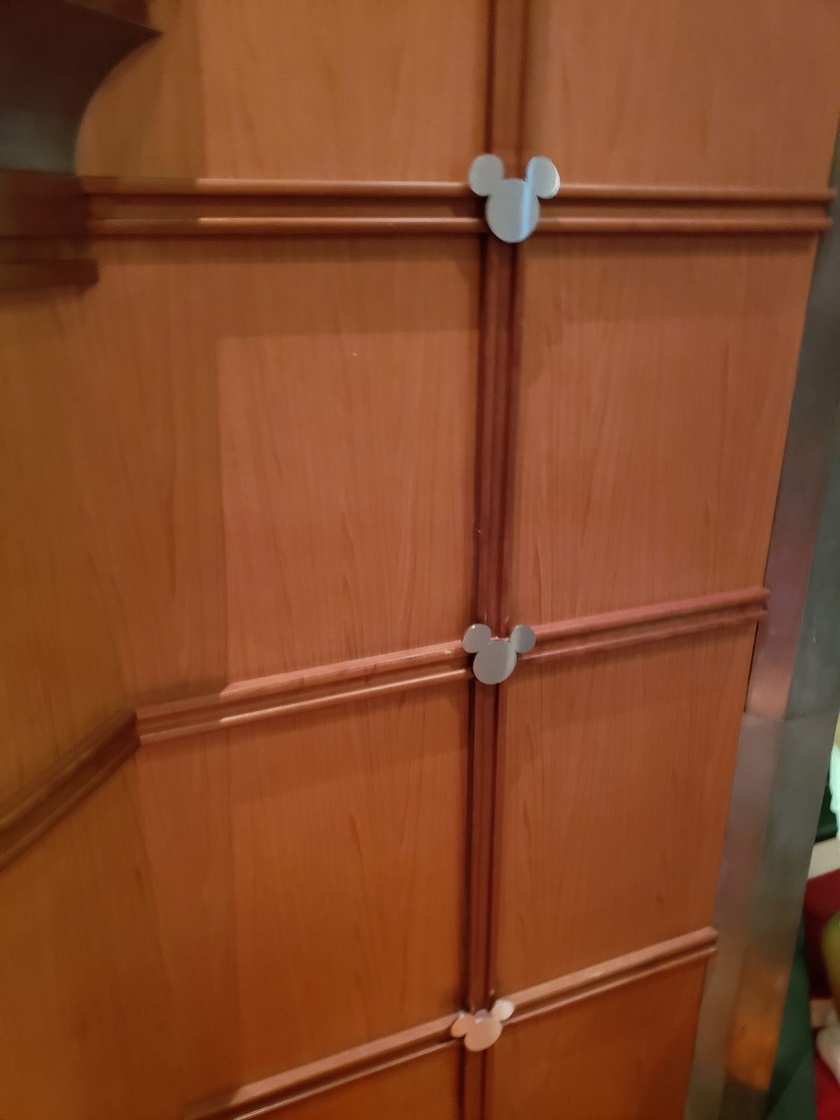 Hidden Mickeys tucked into the wood paneling