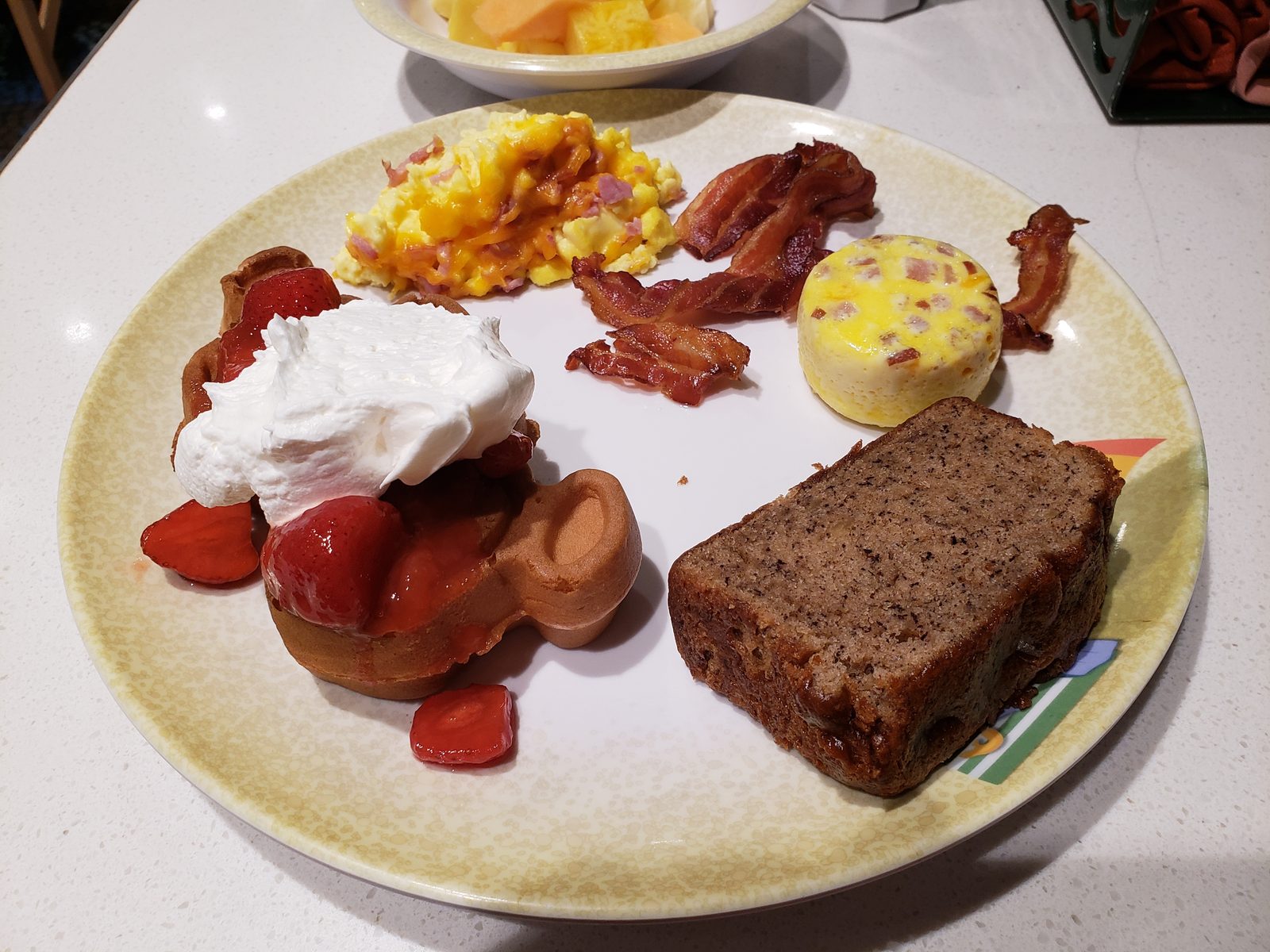 Breakfast of eggs, bacon and banana bread