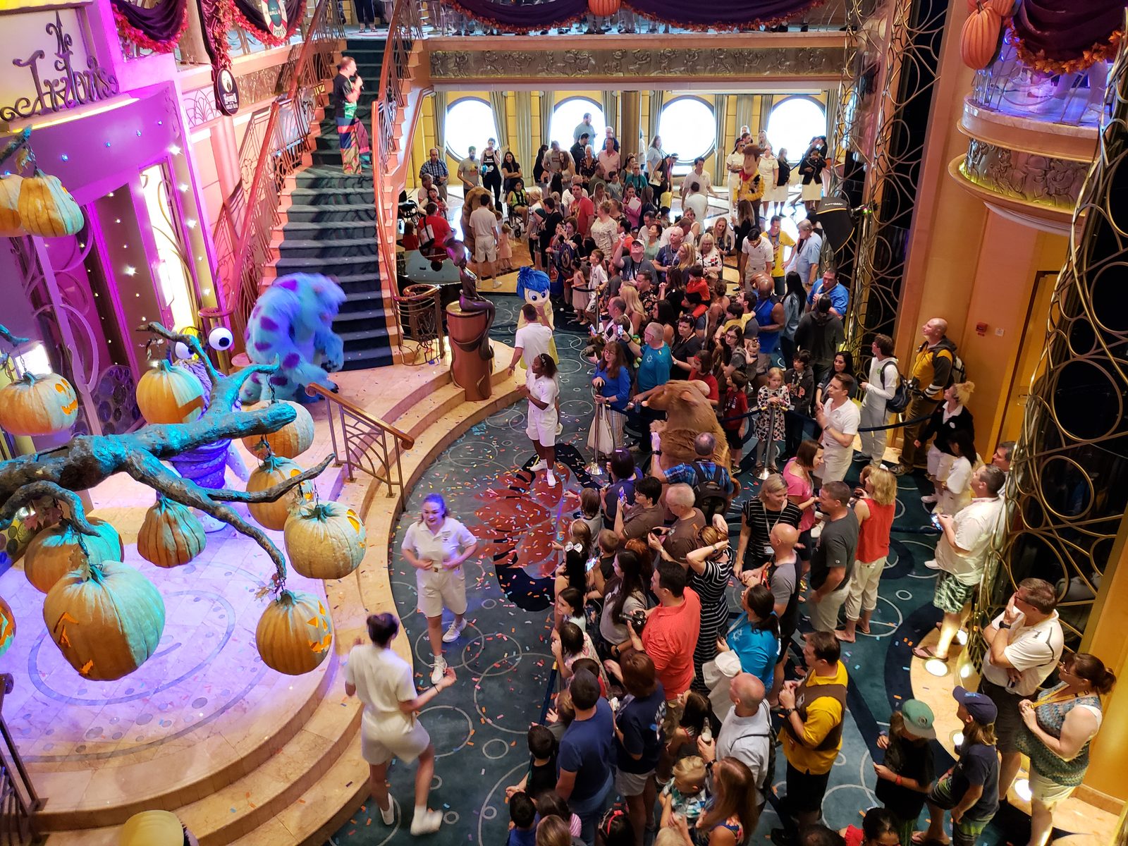 Sulley and the Pixar characters at the party in the Lobby Atrium, decorated for Halloween