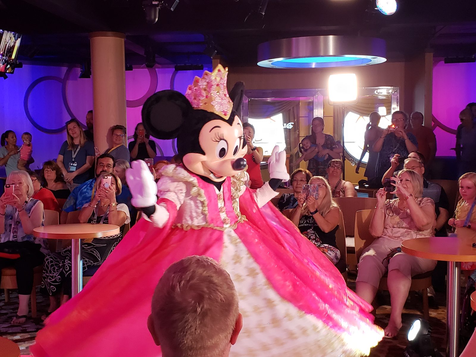 Minnie Mouse in her pink princess gown and tiara at Minnie's fashion show