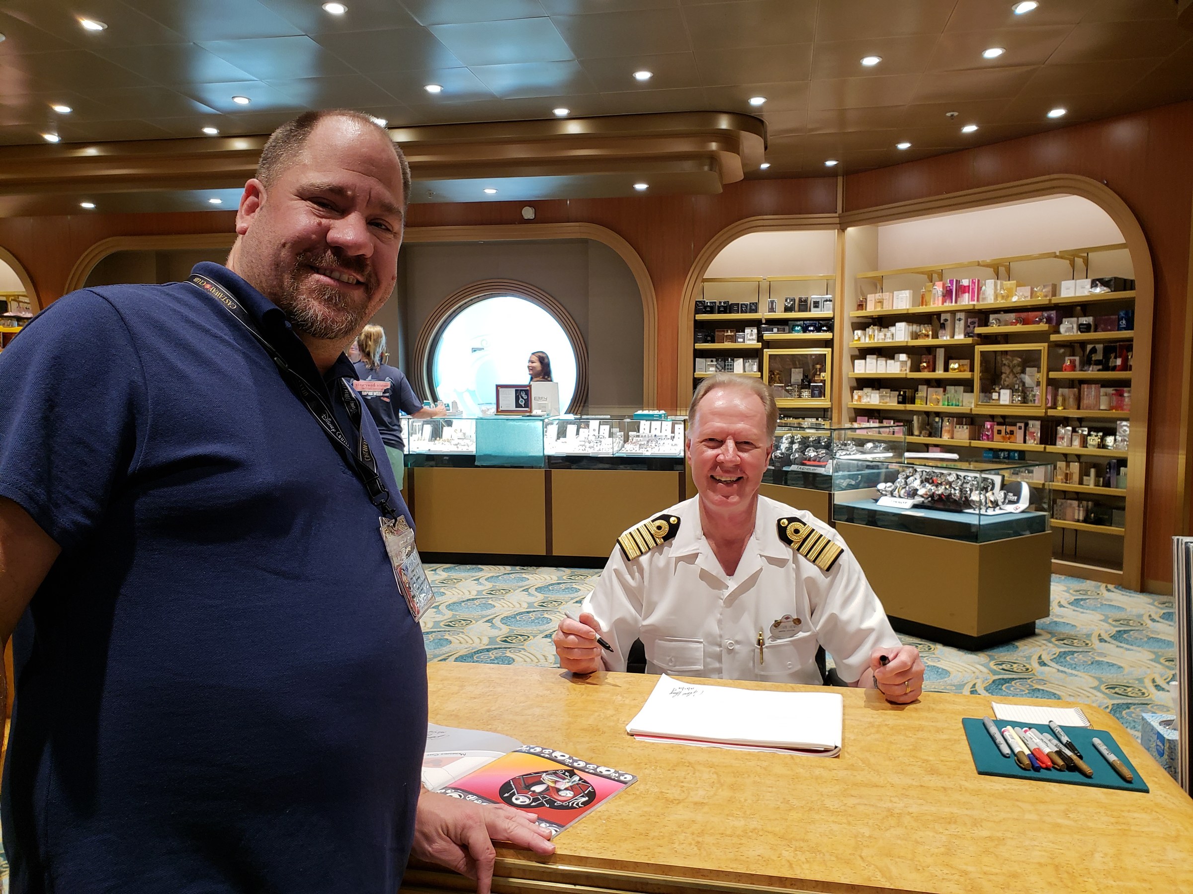 Captain Henry signing for Michael in the ship's shop