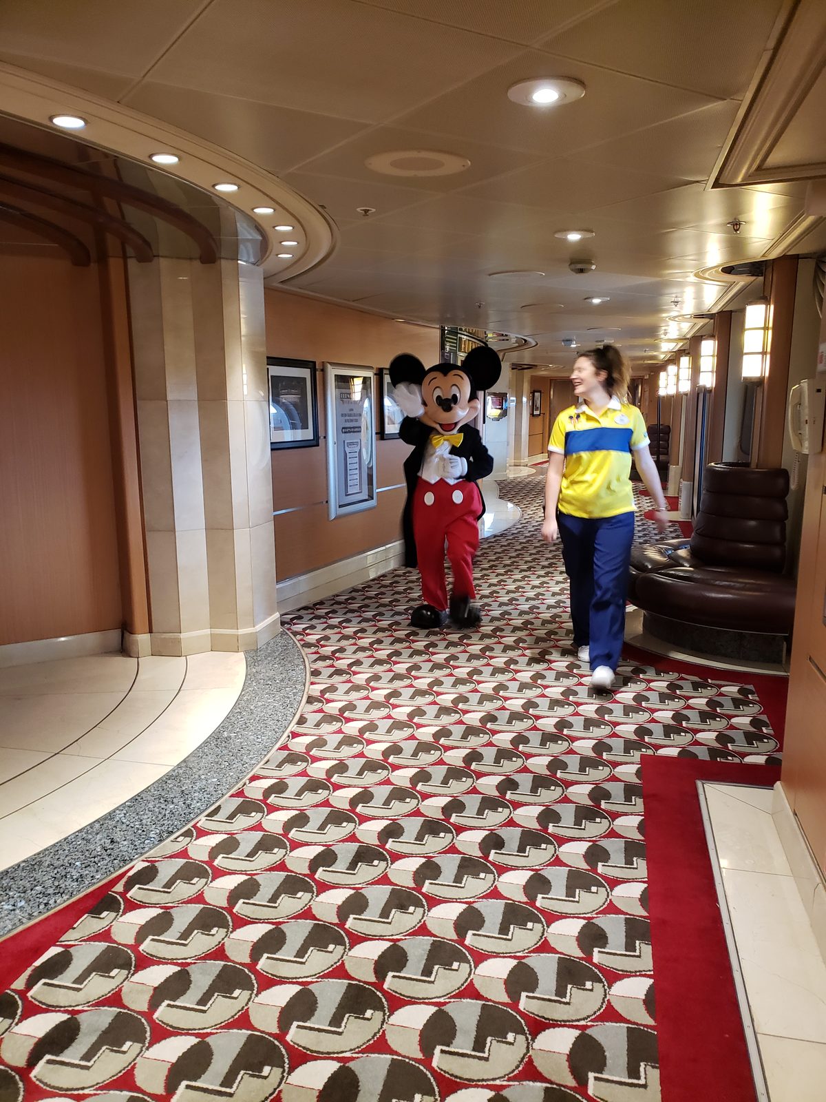 Mickey Mouse strolling a corridor