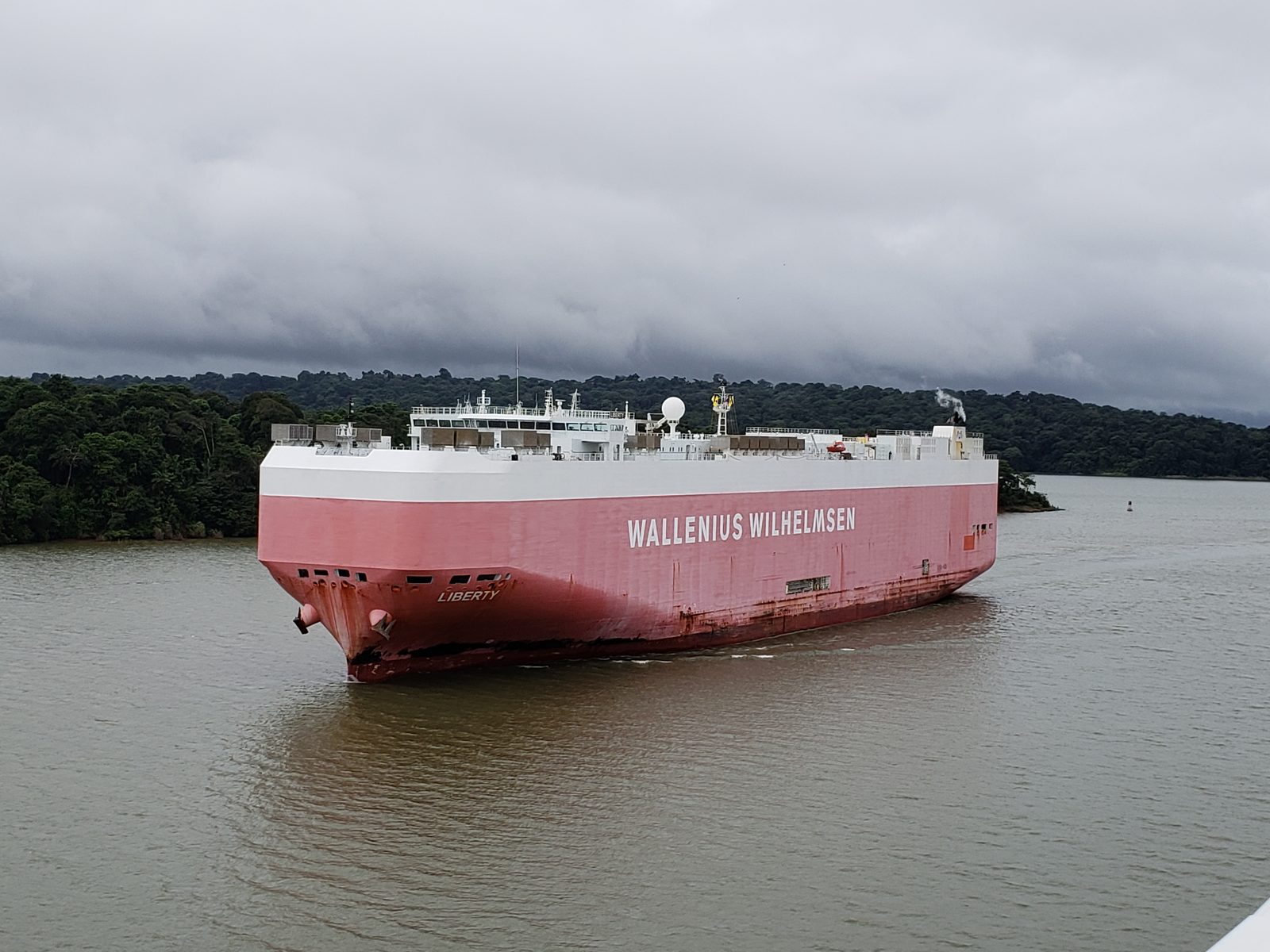 A car carrier passes close by