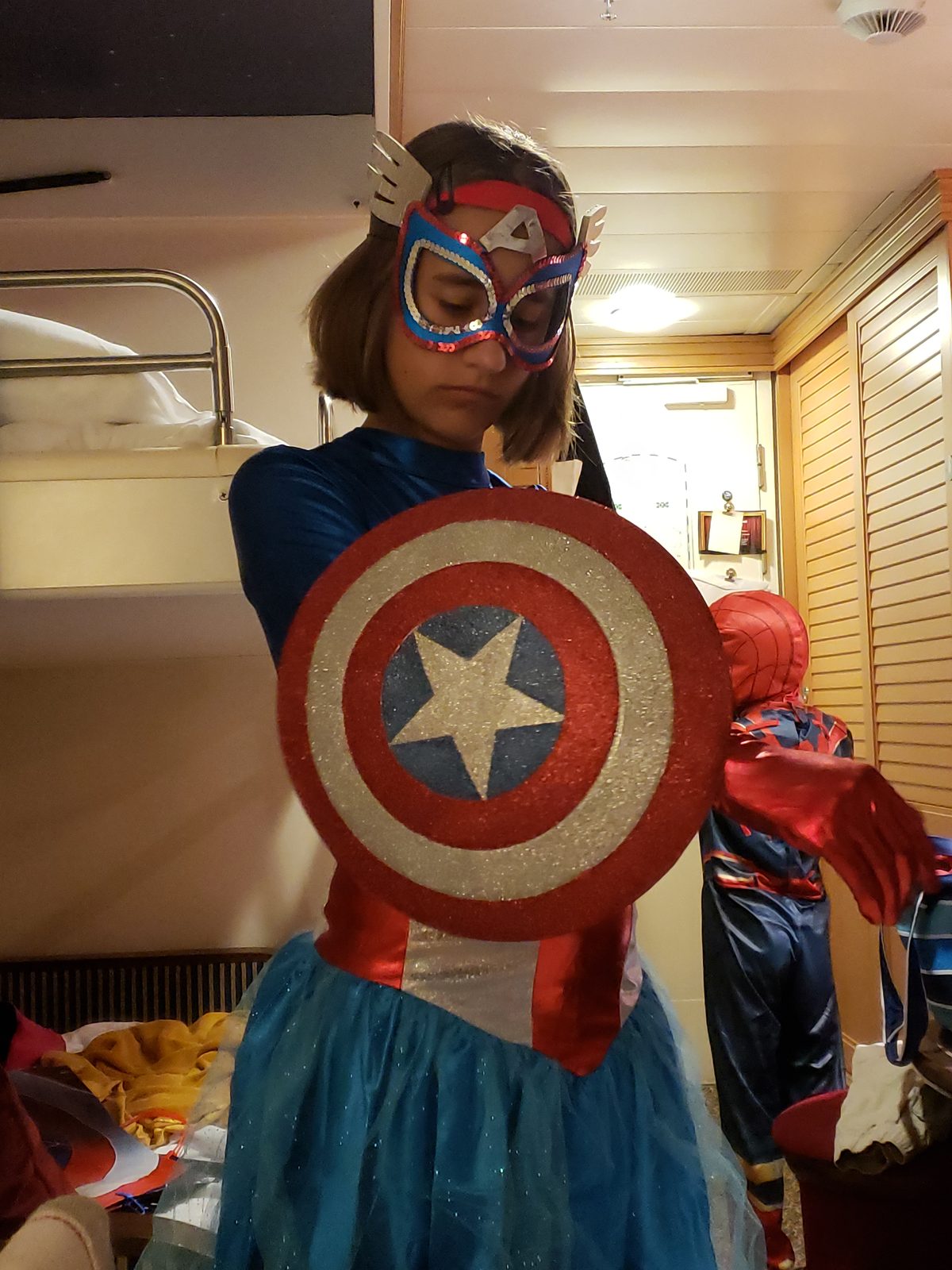 Lisa dressed as a Captain America hero