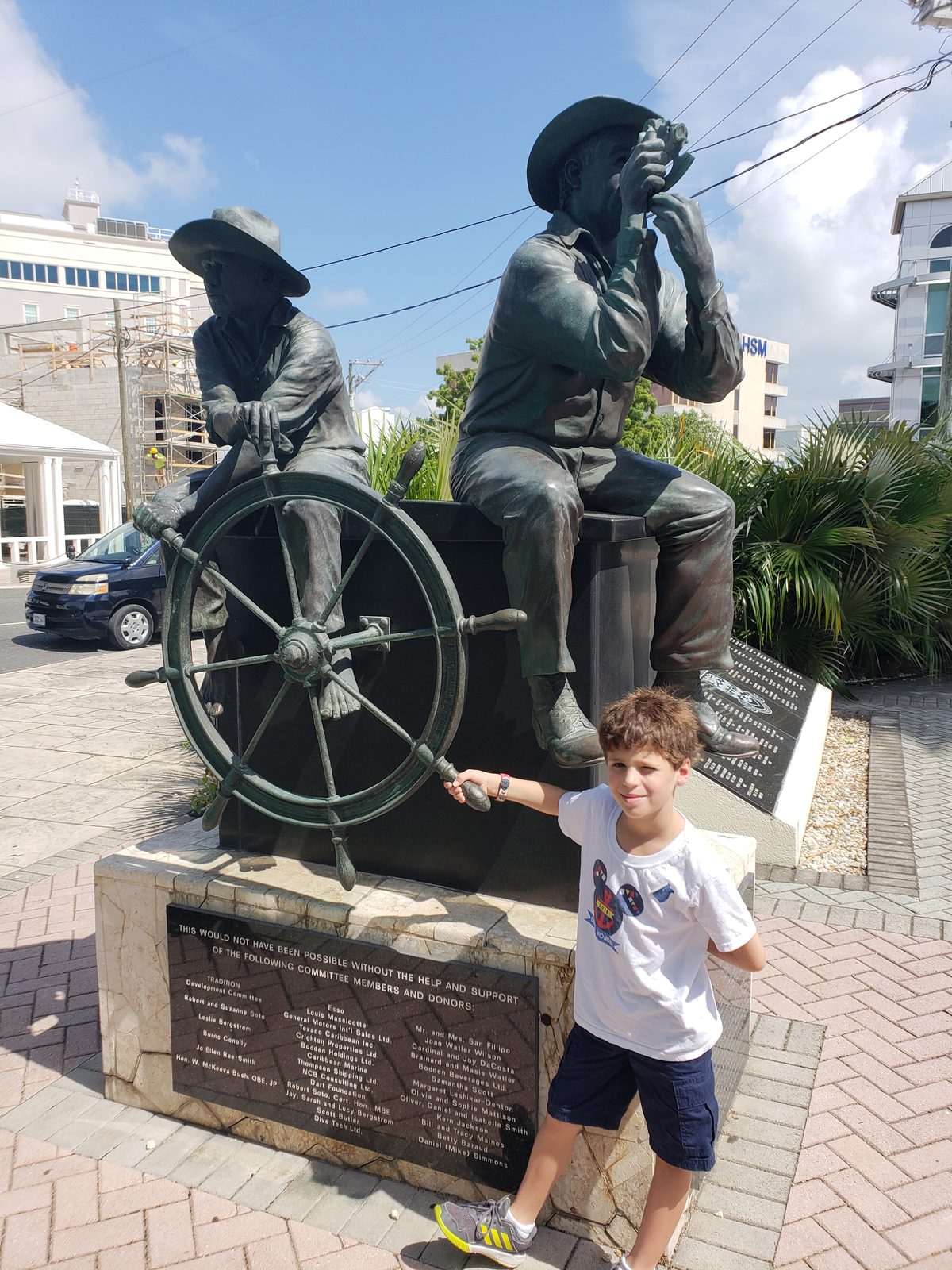 Thomas at the waterfront statue of two Cayman seafarers