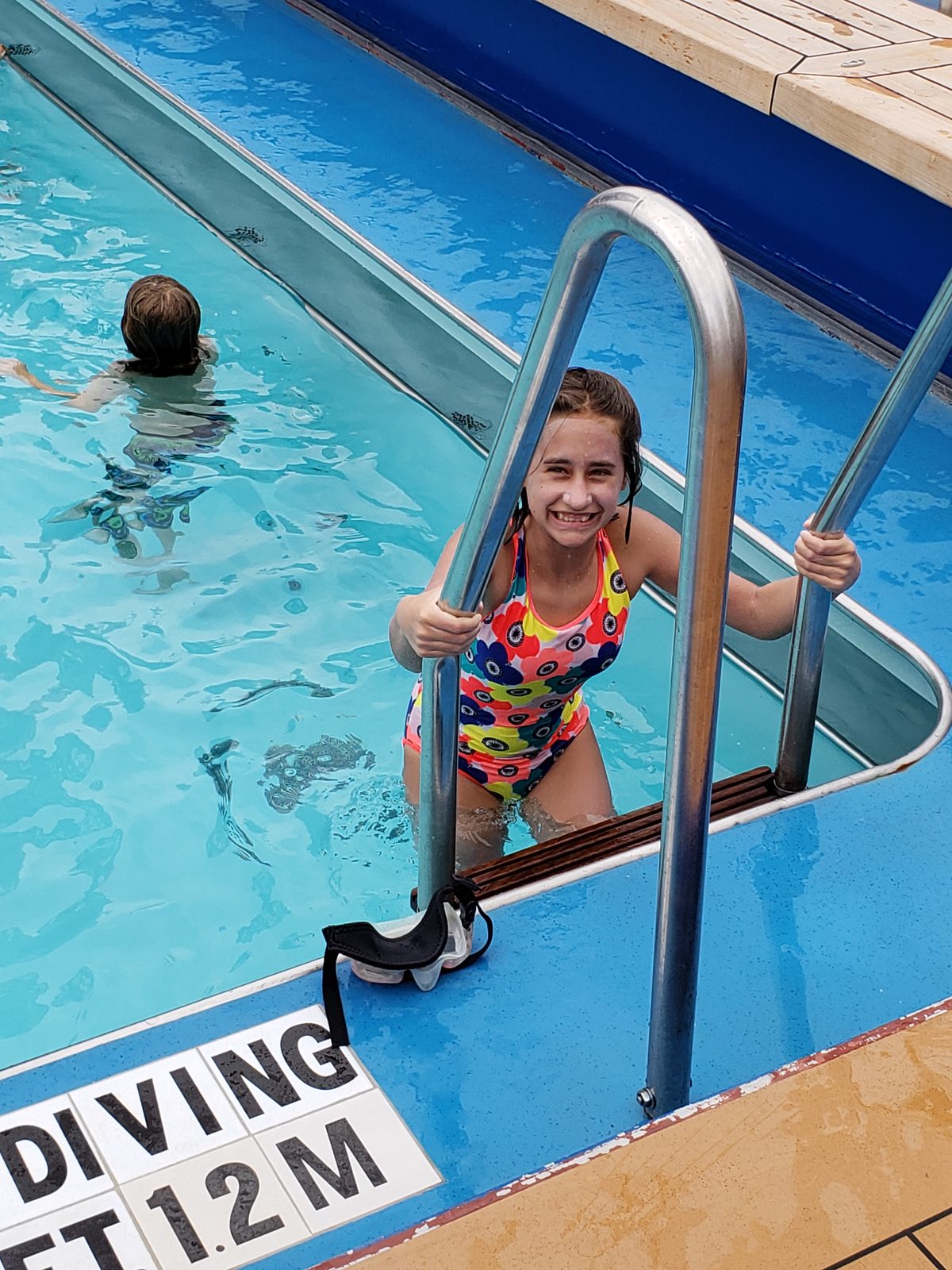 Lisa climbing out of the pool for air