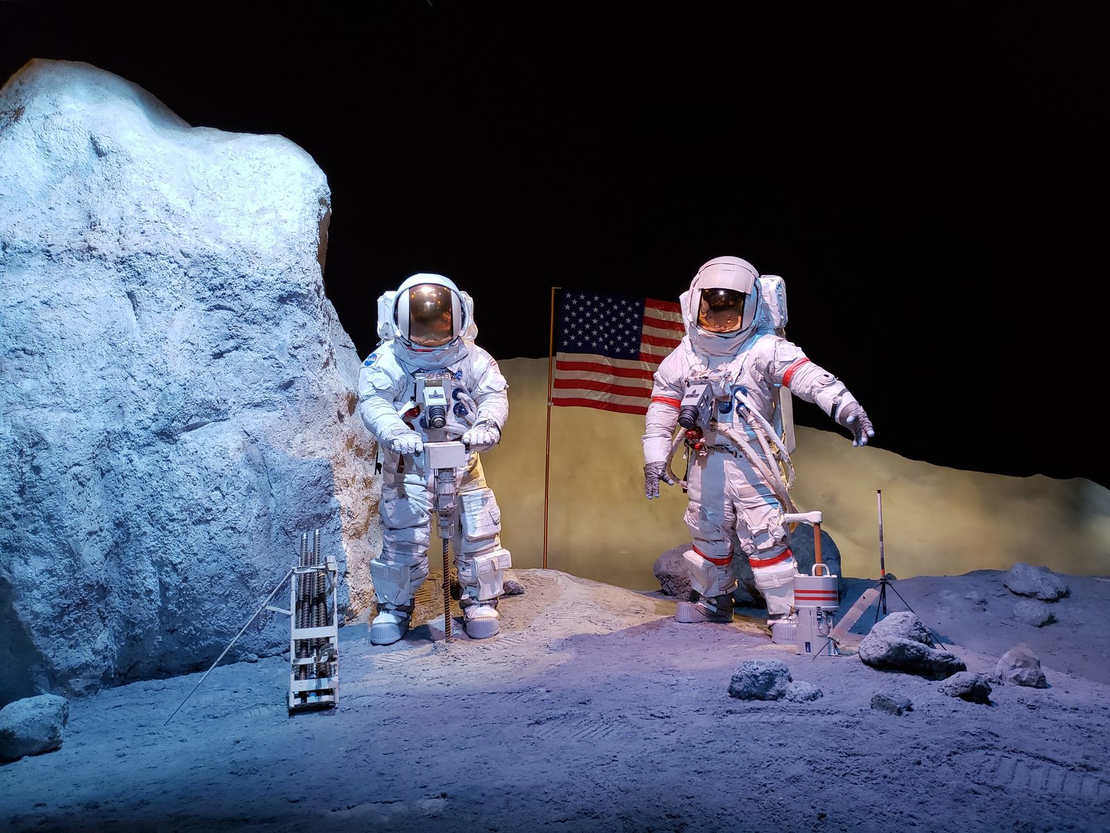 Astronauts posted on a mock moon surface