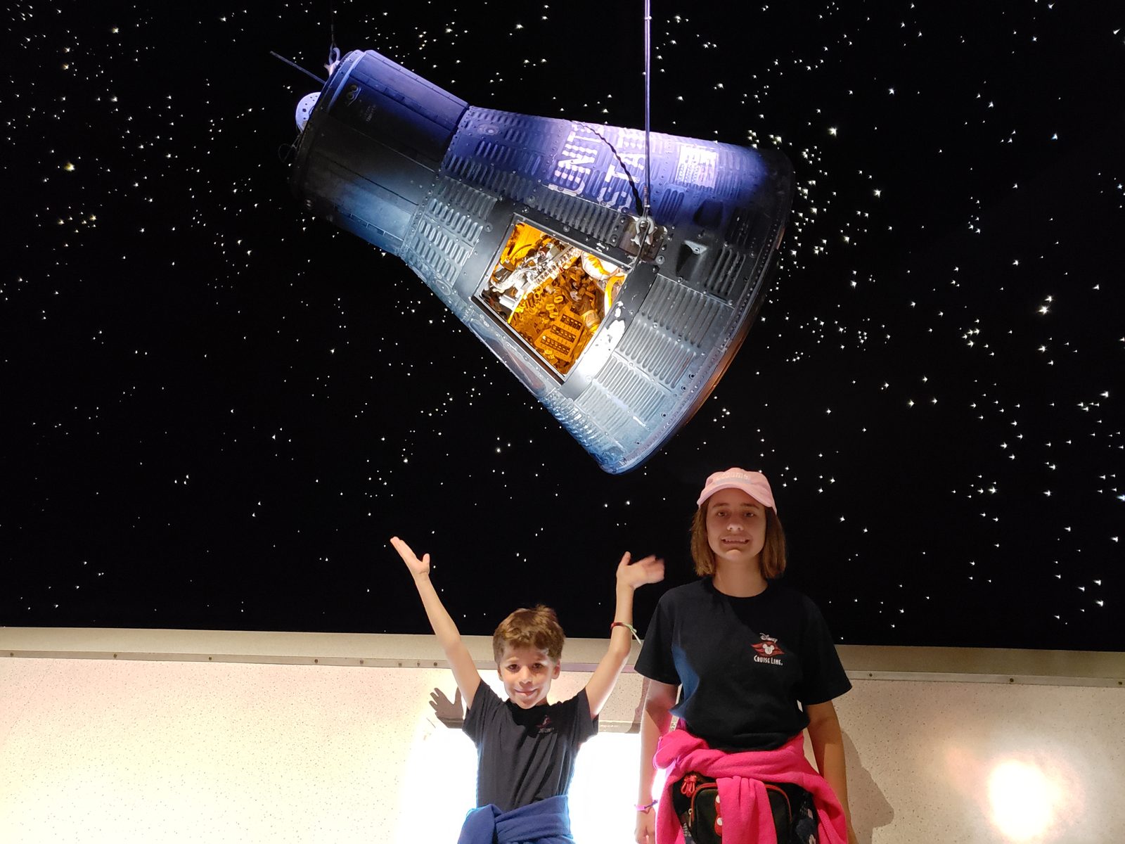 Thomas and Lisa celebrate under the capsule display