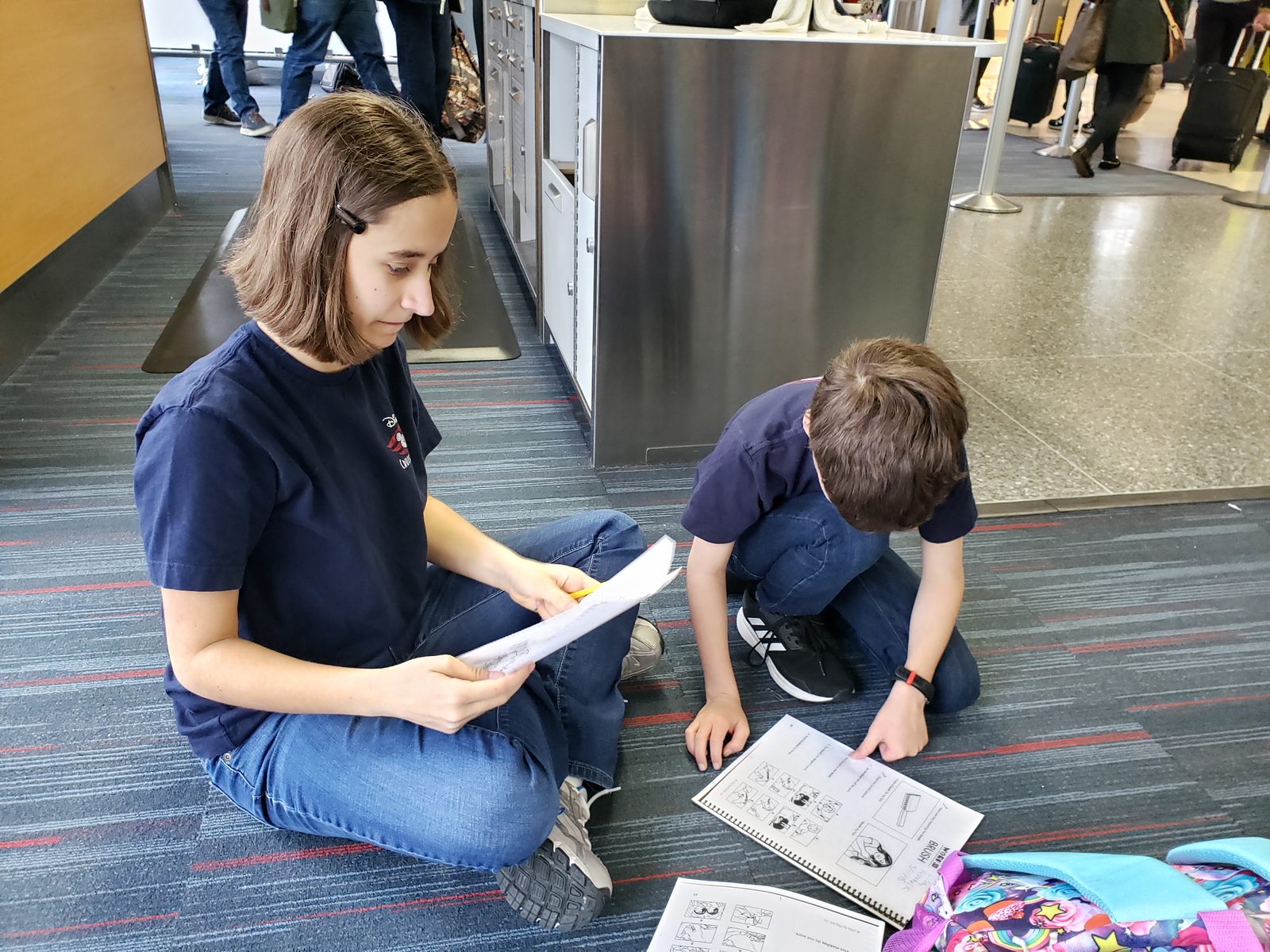 Lisa and Thomas finish homework before we board