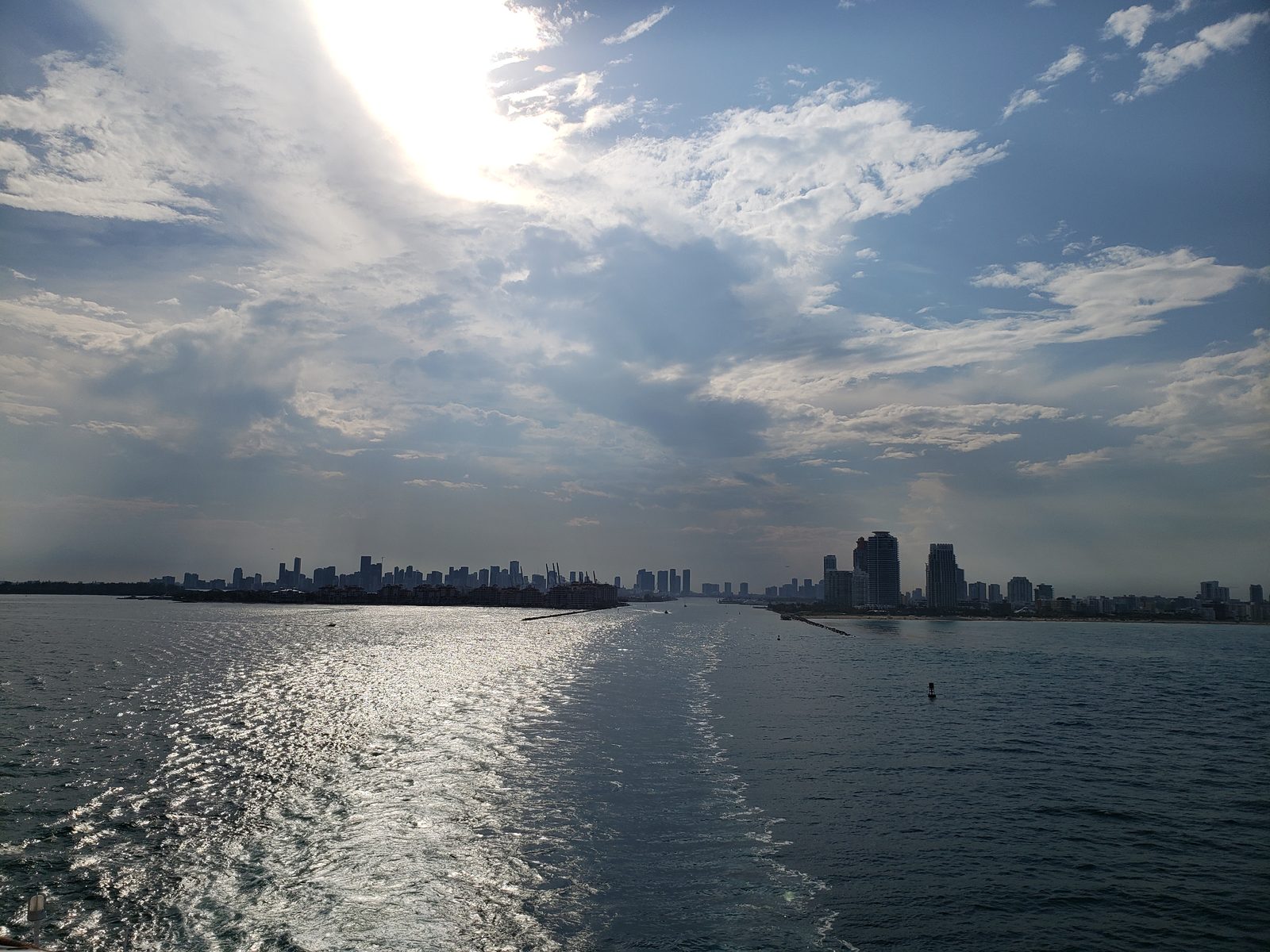 Miami slides away behind our wake