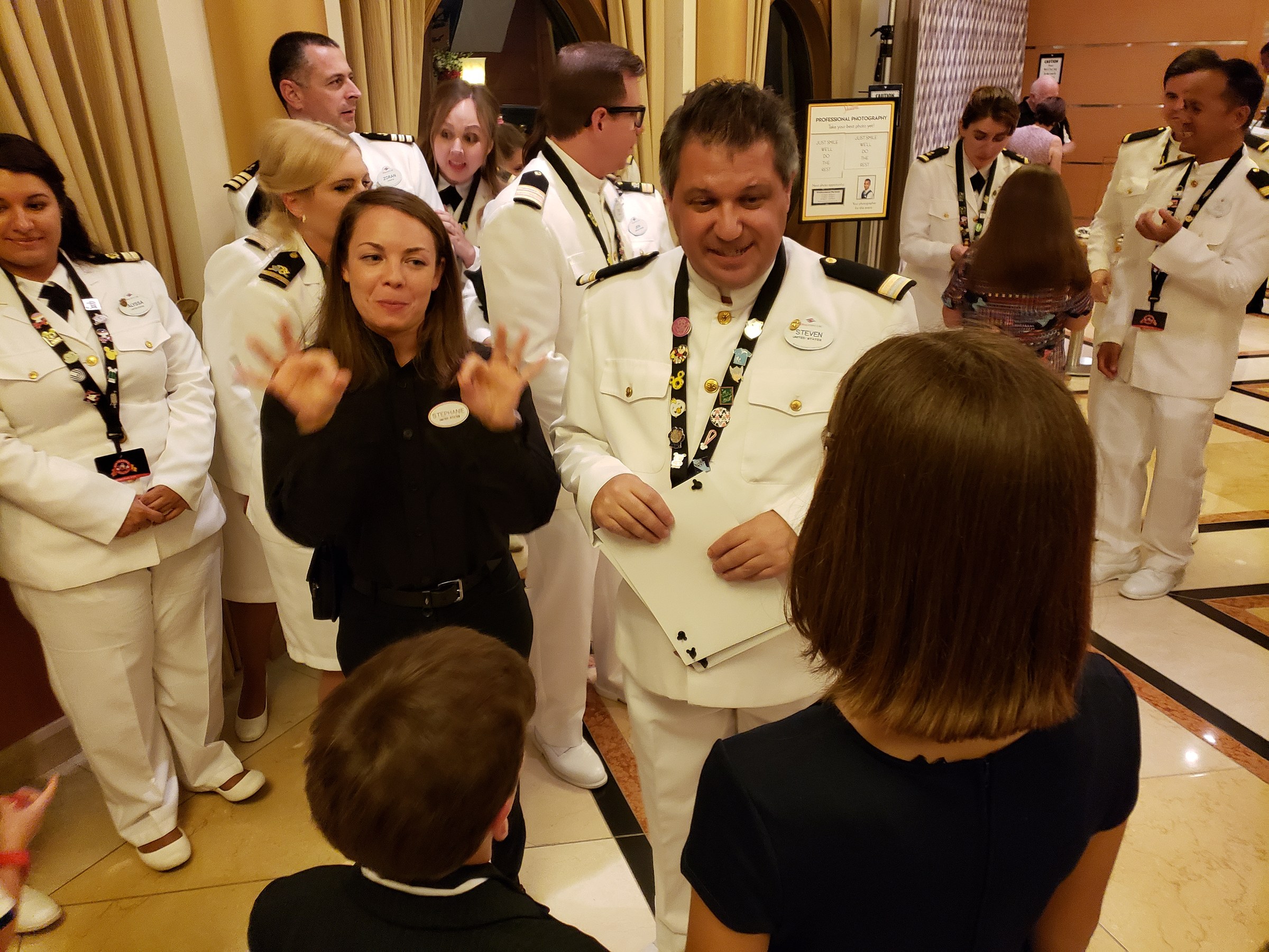Stephanie interpreting among the ship's officers