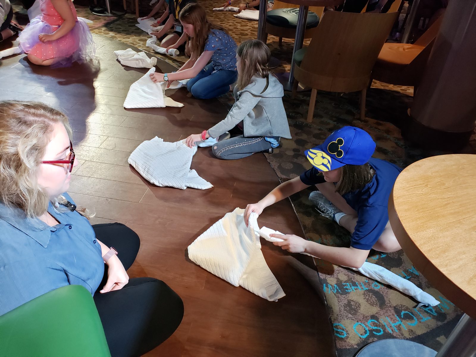 Folding towel animals with the Cast Members at towel class