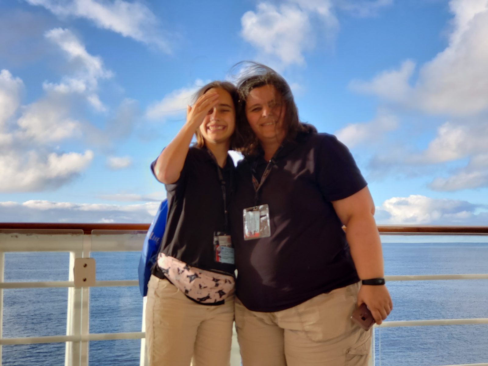 Kathy and Lisa at the rail as the sun goes down