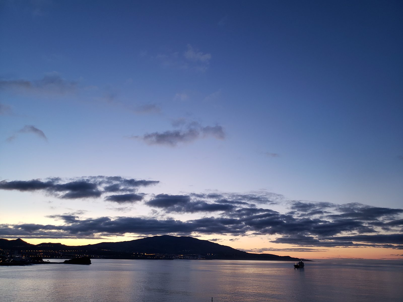 Sunrise coming into Ponta Delgada