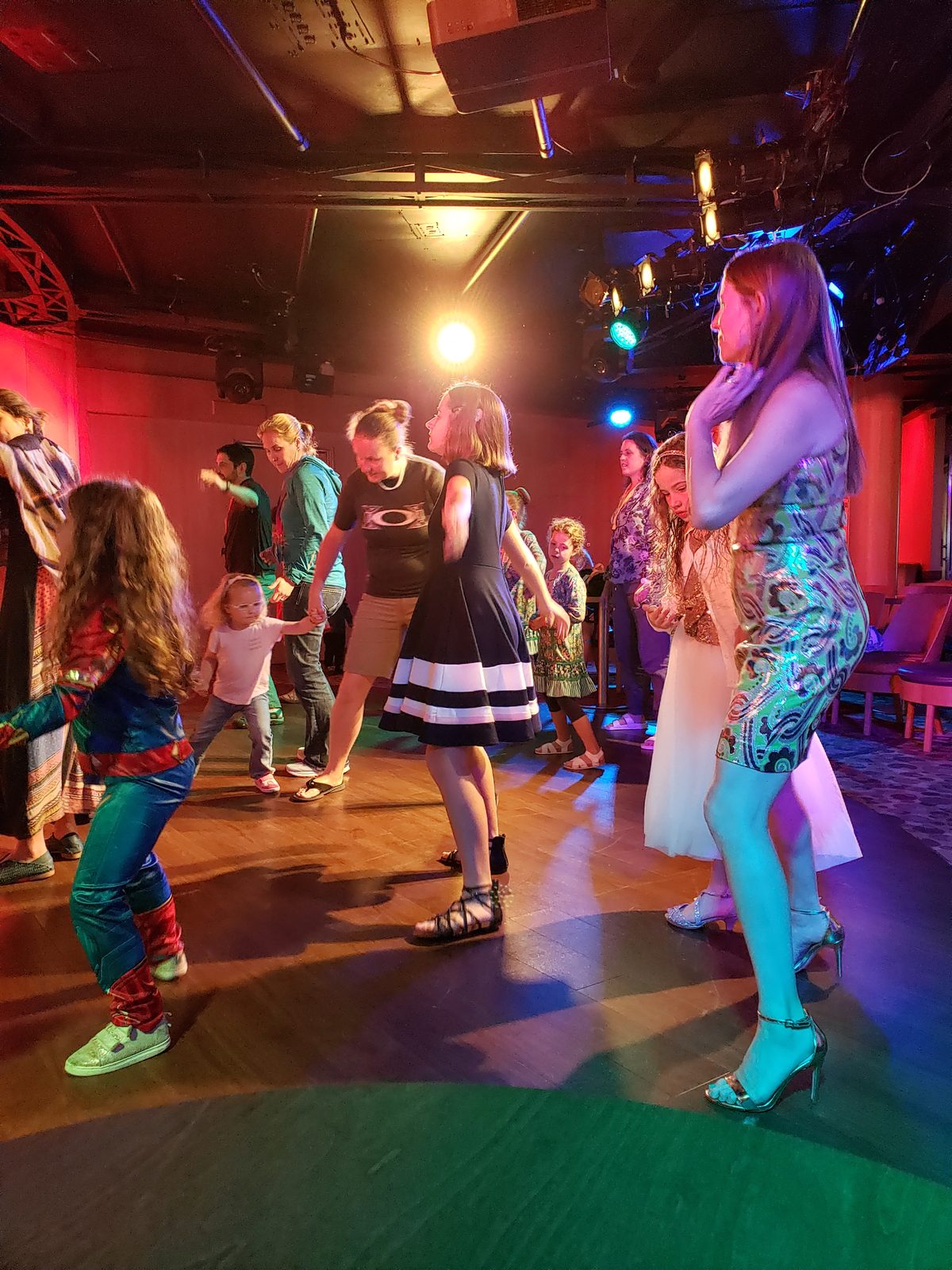 Dancing under colored lights to close the day