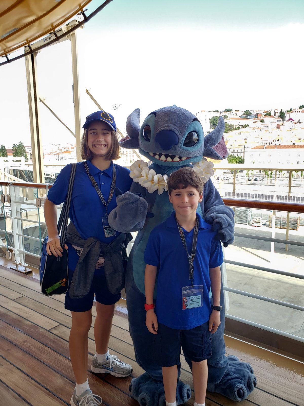 Lisa, Stitch in his flower lei & Thomas on deck in Lisbon