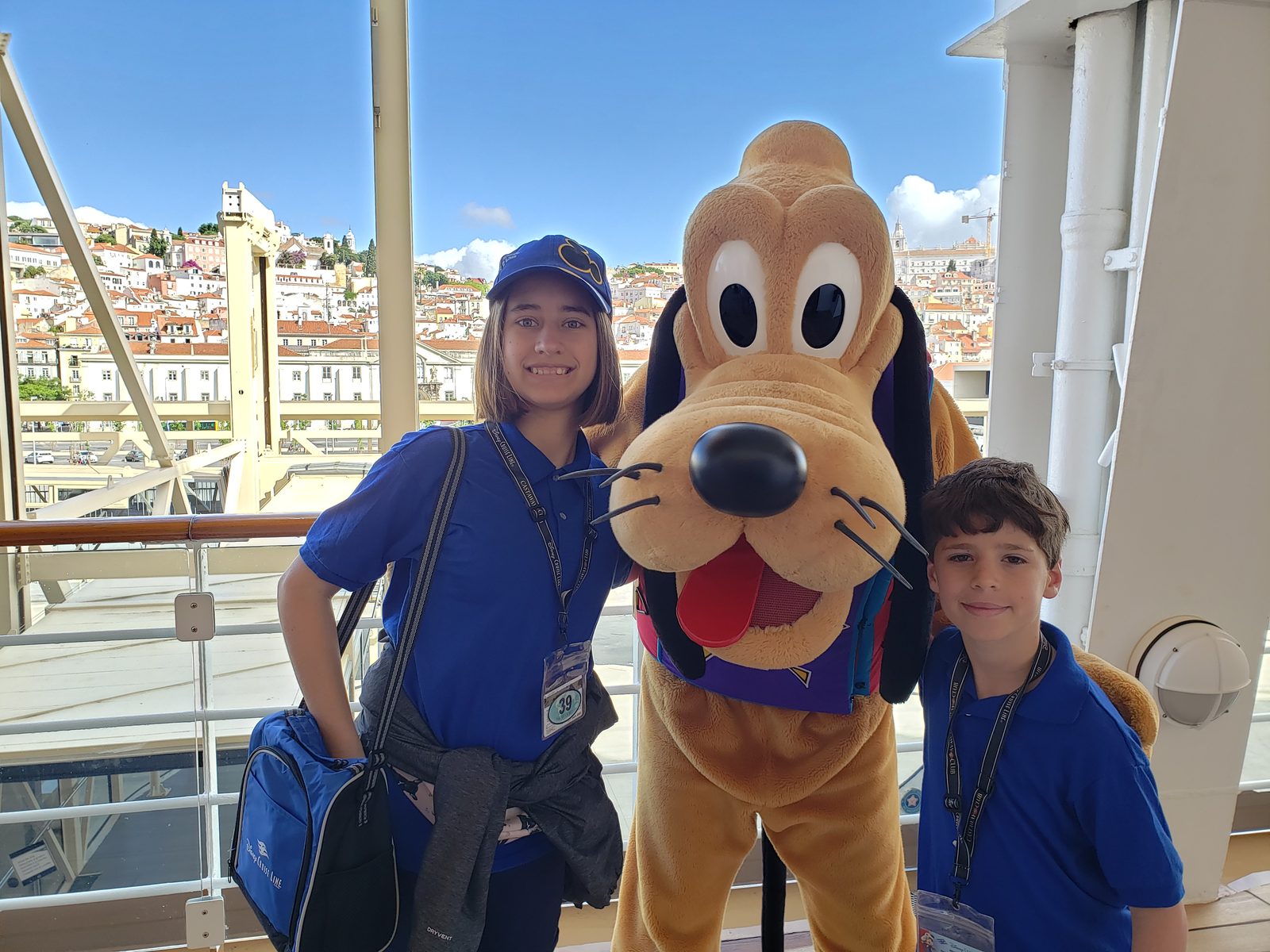 Lisa, Pluto in his purple and yellow outfit & Thomas on deck in Lisbon