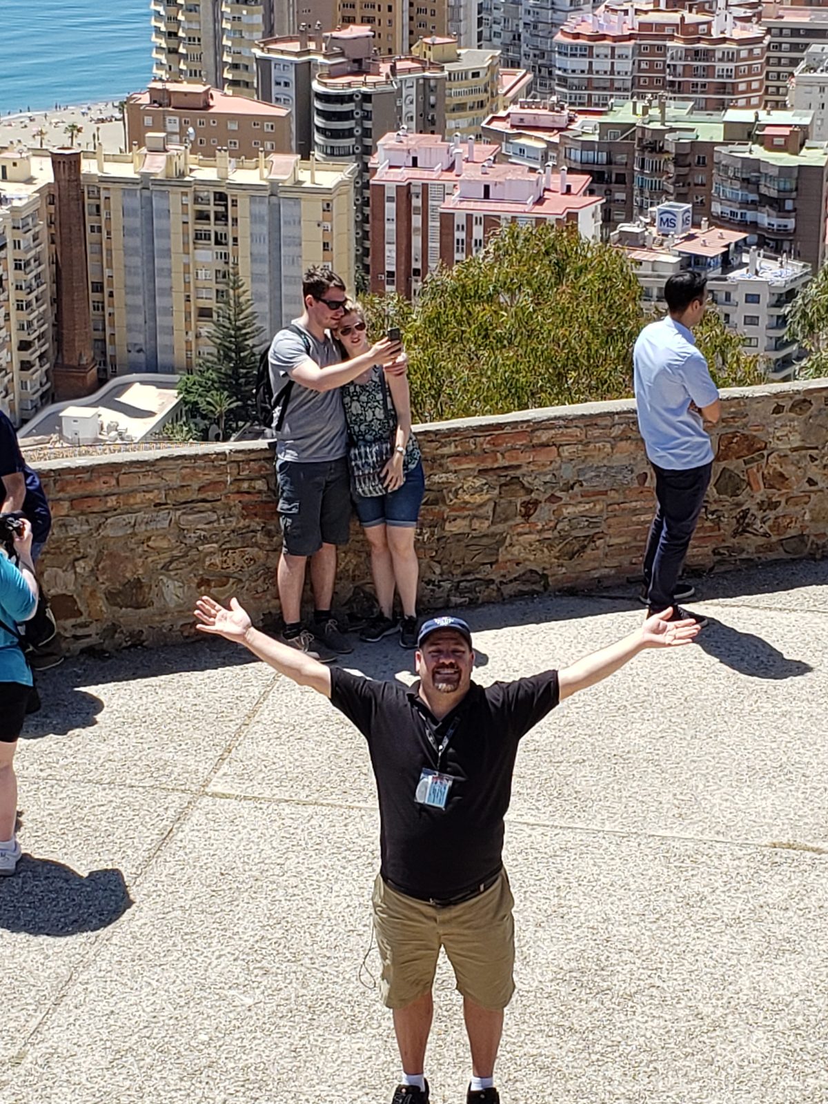 Michael with arms wide on the Gibralfaro walls