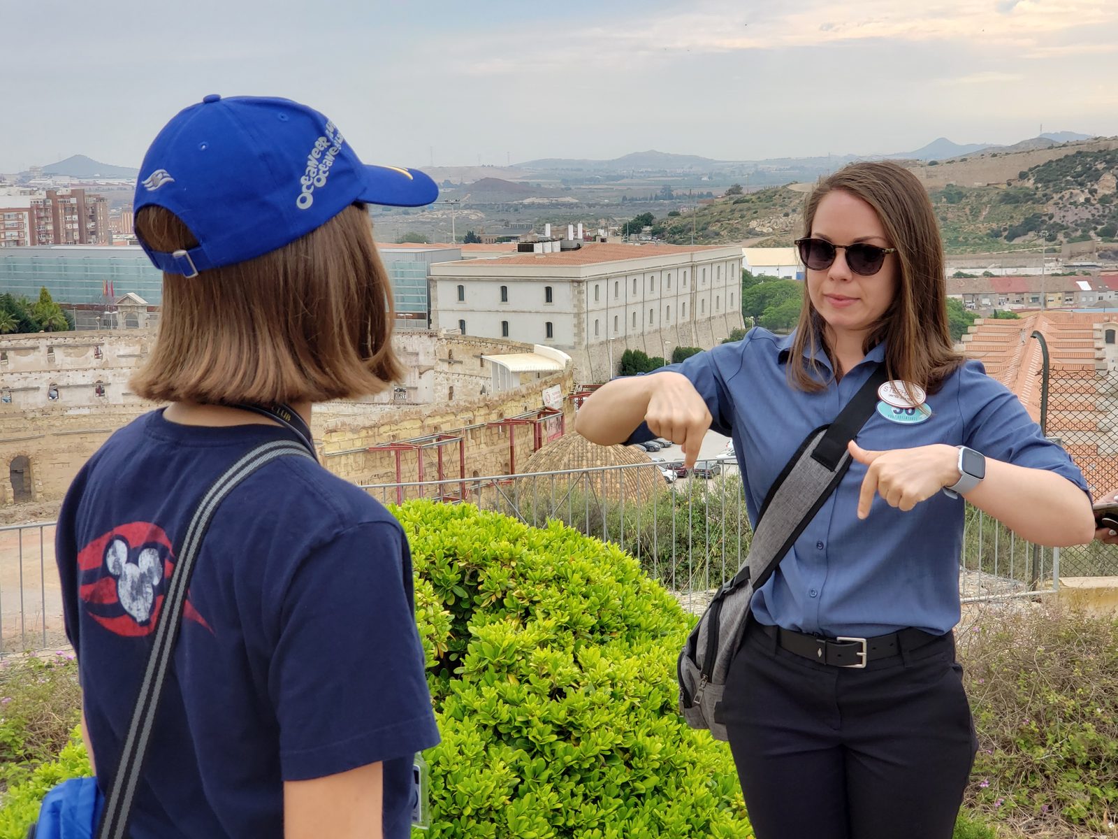 An interpreter signs to Lisa at the castle