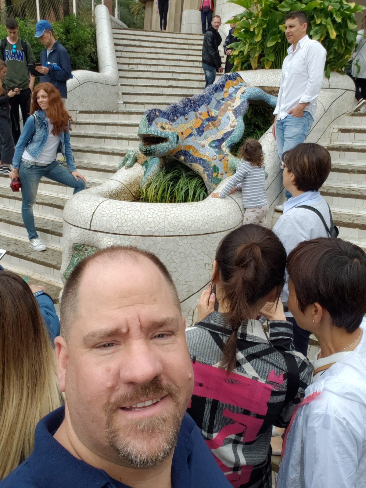 A selfie by Park Guell's mosaic dragon