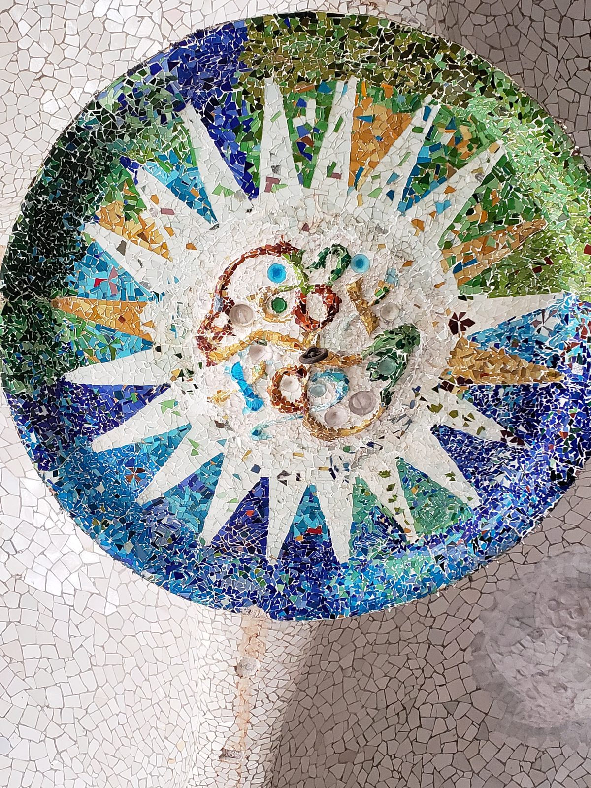 A mosaic sun on the terrace ceiling