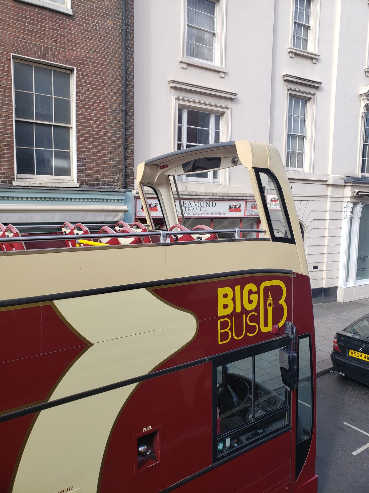 A Big Bus waits outside our hotel