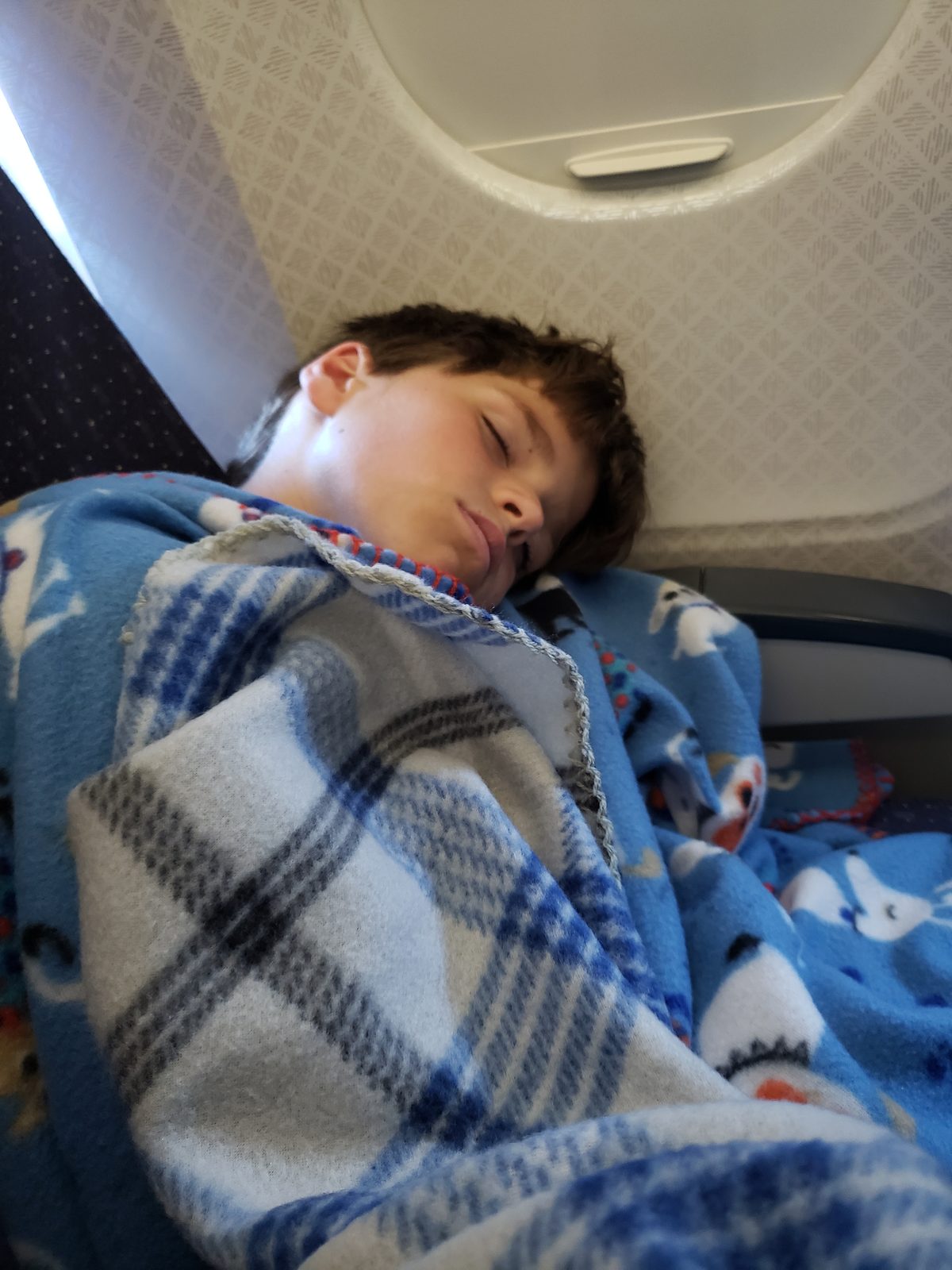 Thomas asleep on the flight home