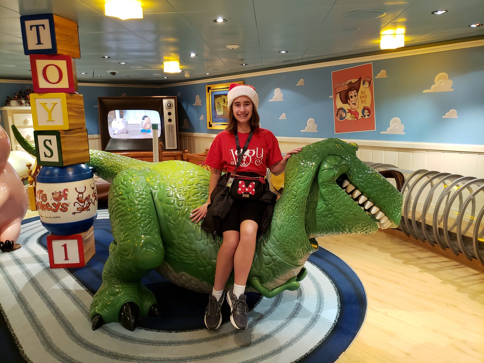 Lisa rides the giant toy dinosaur