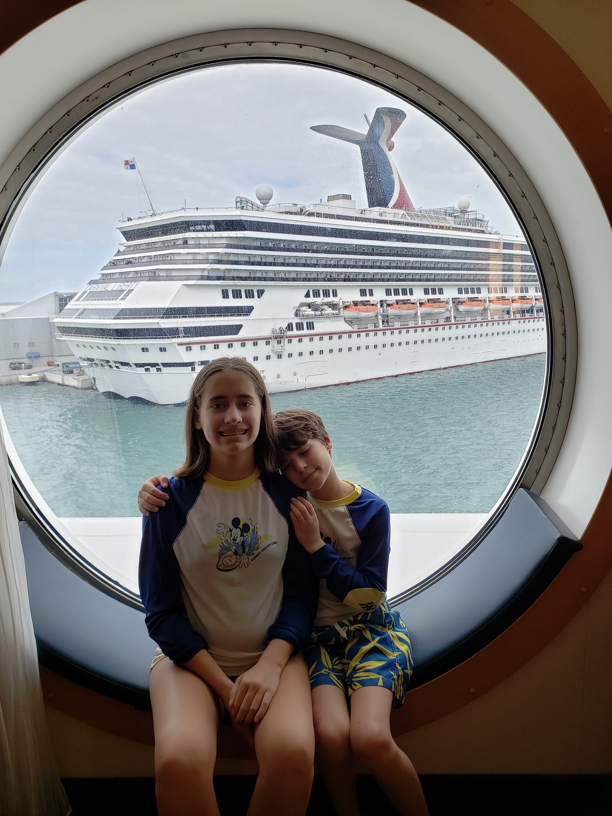 Lisa and Thomas at our porthole, another ship outside