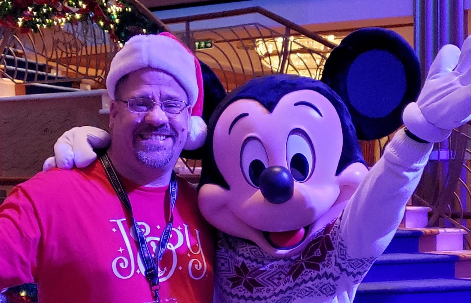 I run into Mickey in the atrium, Santa hat and all