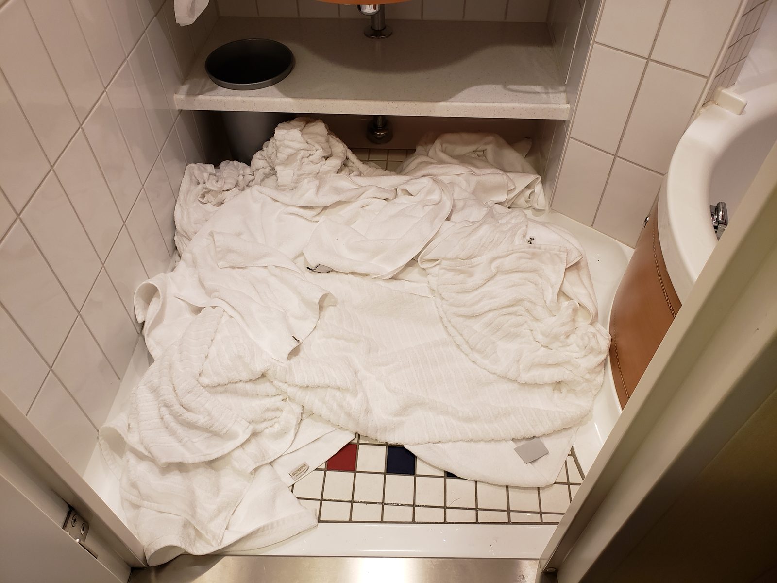 Wet towels piled in the shower after Castaway Cay