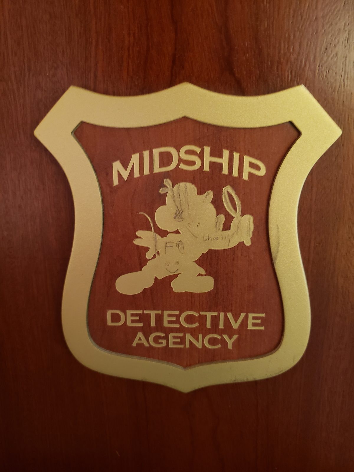 The Midship Detective Agency badge on the Dream