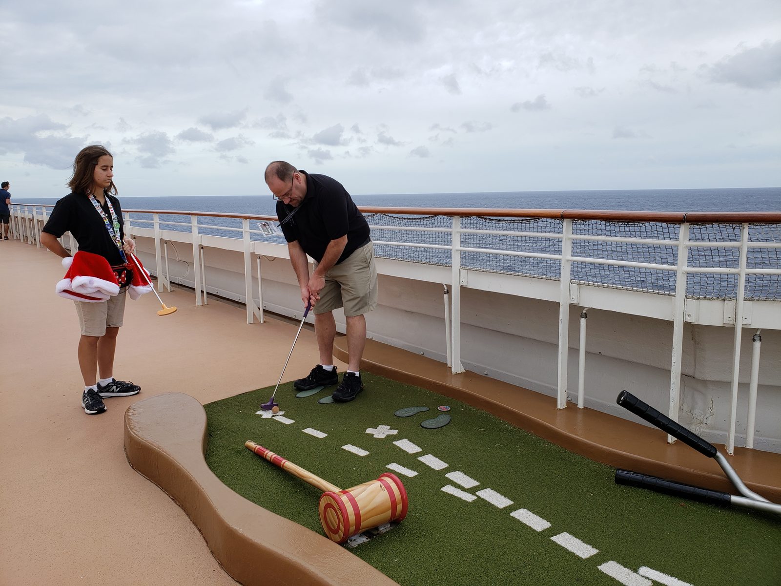 Lisa and me playing mini golf on the sports deck