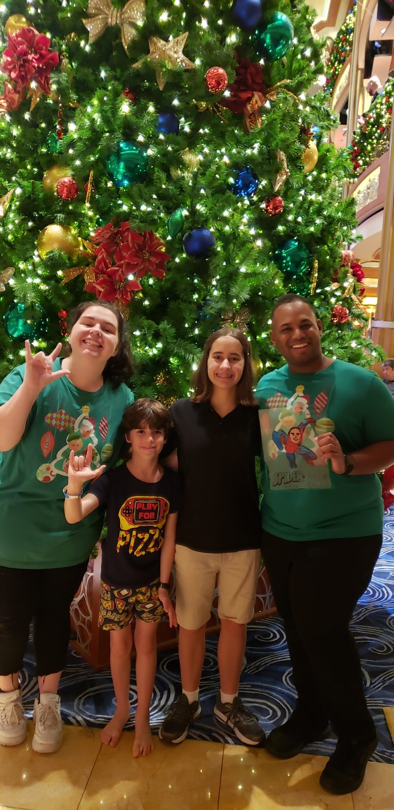 Lisa and Thomas with Kelly and Andrew by the Christmas tree