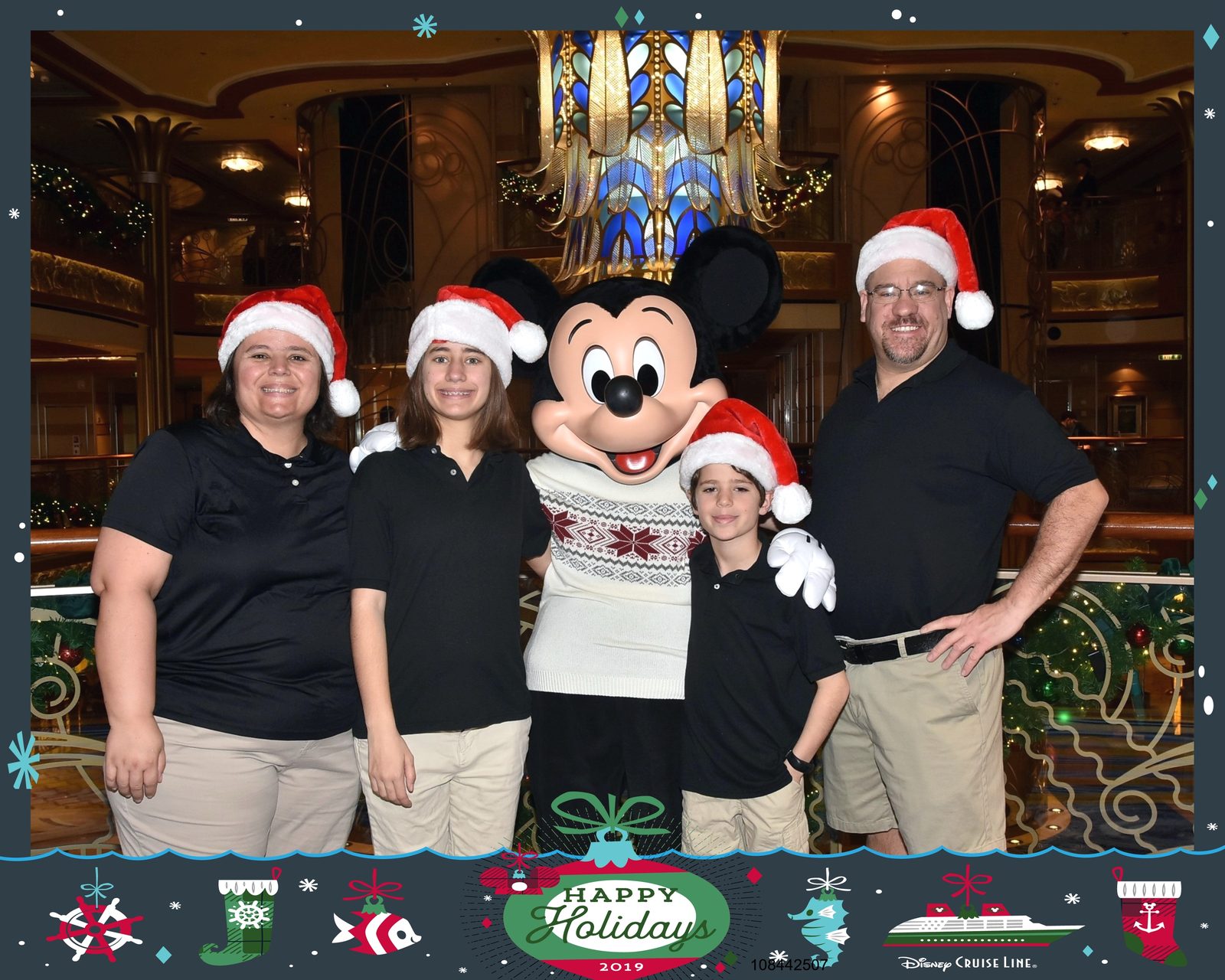 Lisa, Thomas and me with Mickey in his holiday sweater