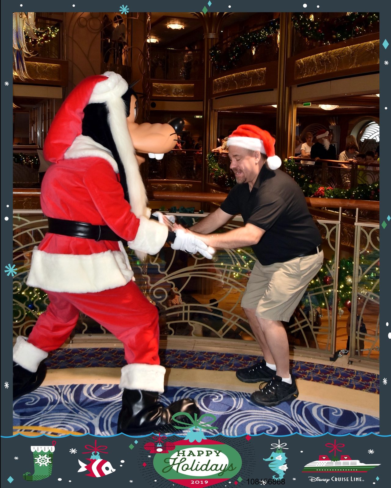 Goofy dressed as Santa clowns around with me
