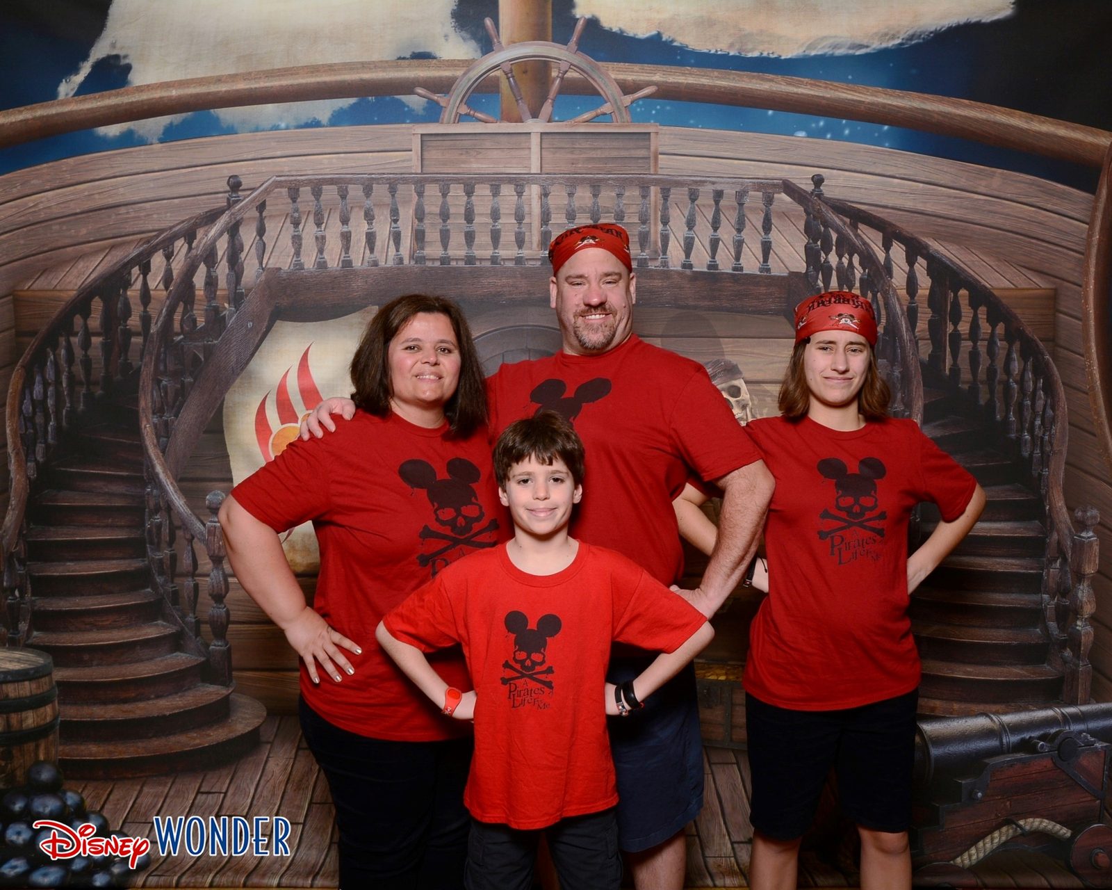 All four of us in matching pirate shirts and bandanas
