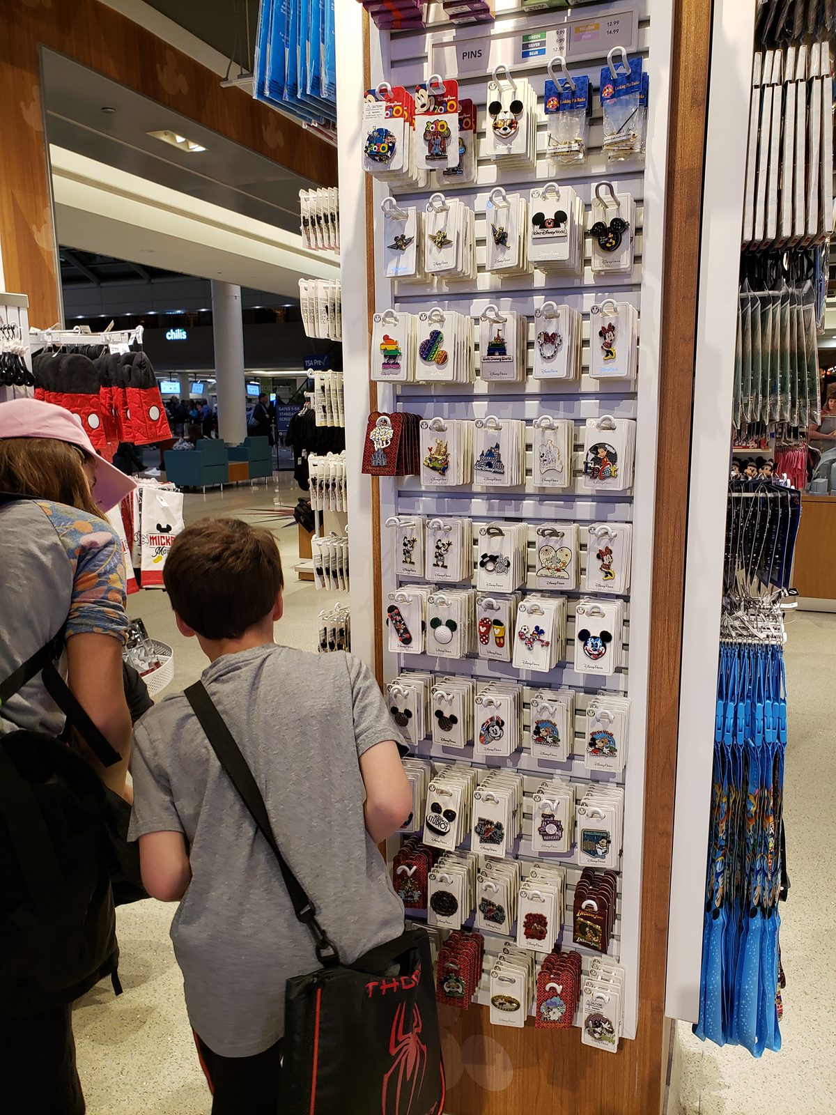 Browsing the pin wall at the Orlando airport
