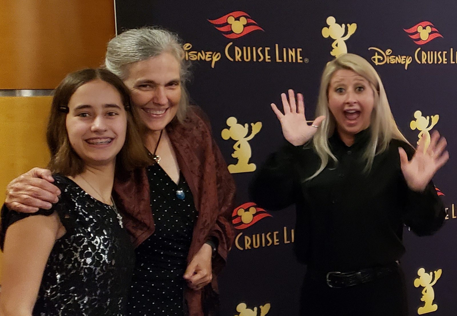 Lisa, LeAnn and Meagan at the photo backdrop on Golden Mickeys night