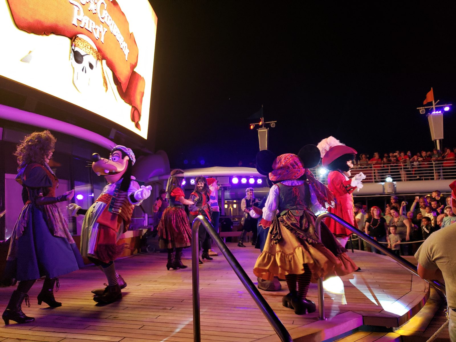 Goofy & Minnie in pirate garb with Mr. Smee & Captain Hook at the Pirates in the Caribbean Deck Party