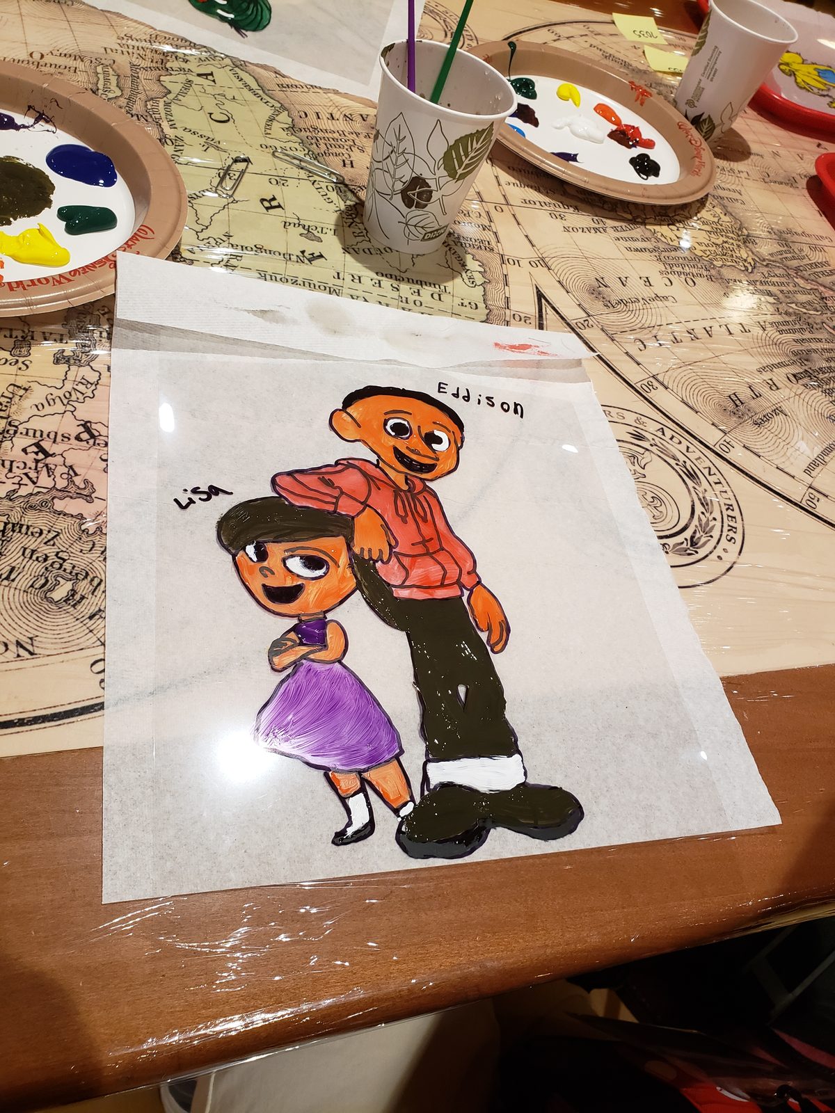 Lisa drawing a picture of her and Eddisson as Disney characters
