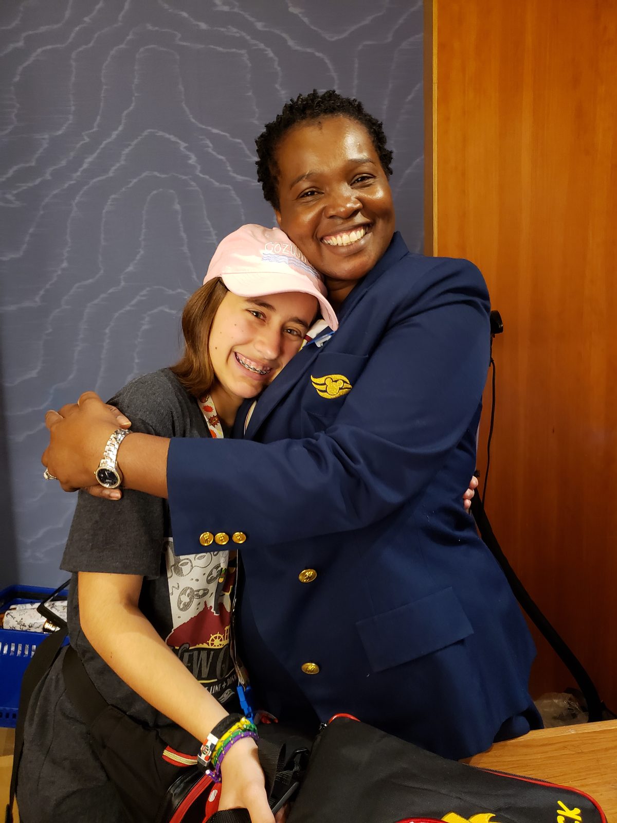 Lisa with a goodbye hug from the Merch team