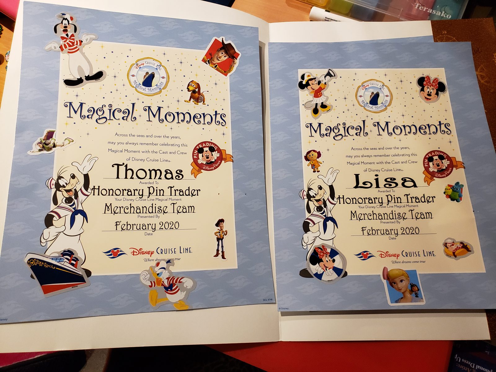 Honorary Pin Trader certificates for Thomas and Lisa