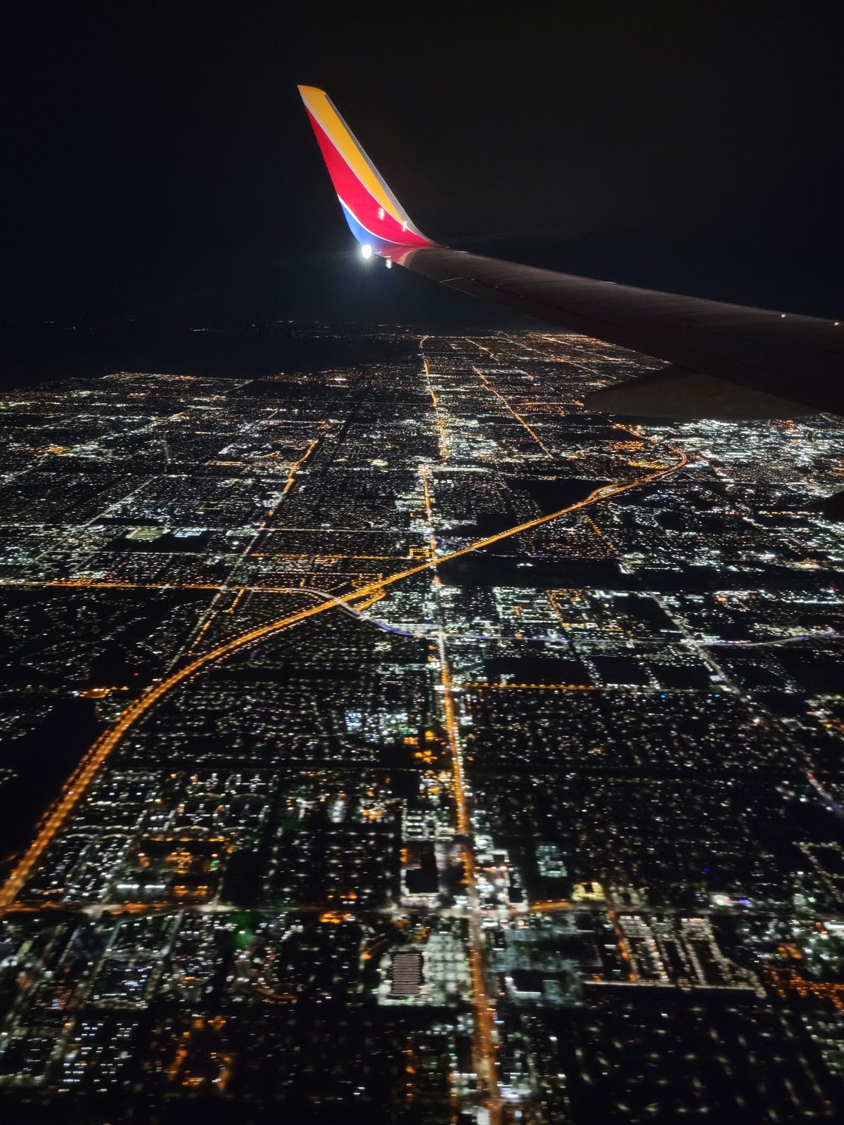 City lights below as we fly to Florida