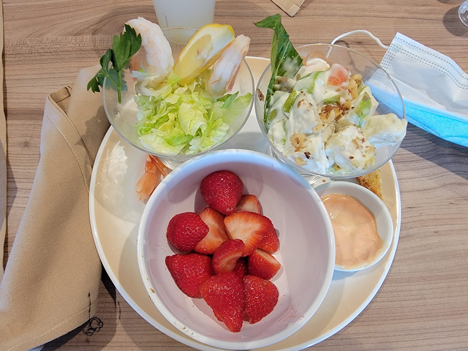 Early lunch on the pool deck, shrimp cocktail and strawberries