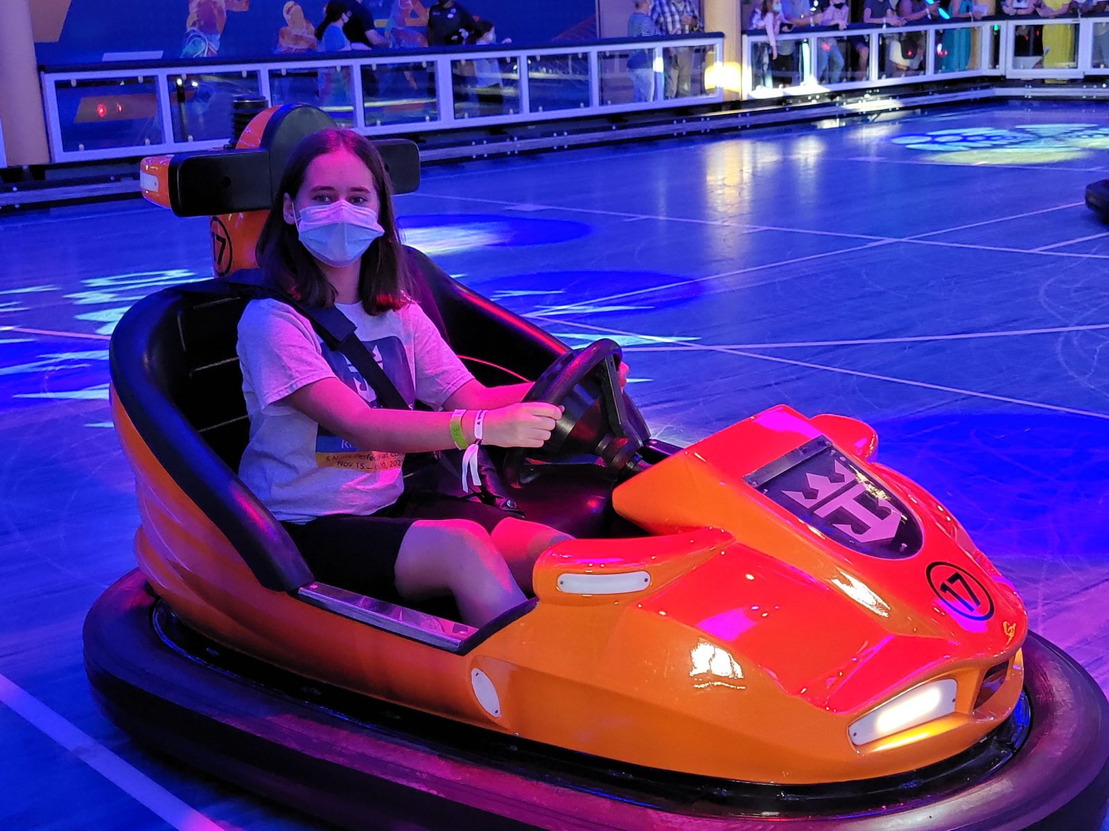 Lisa behind the wheel in bumper cars