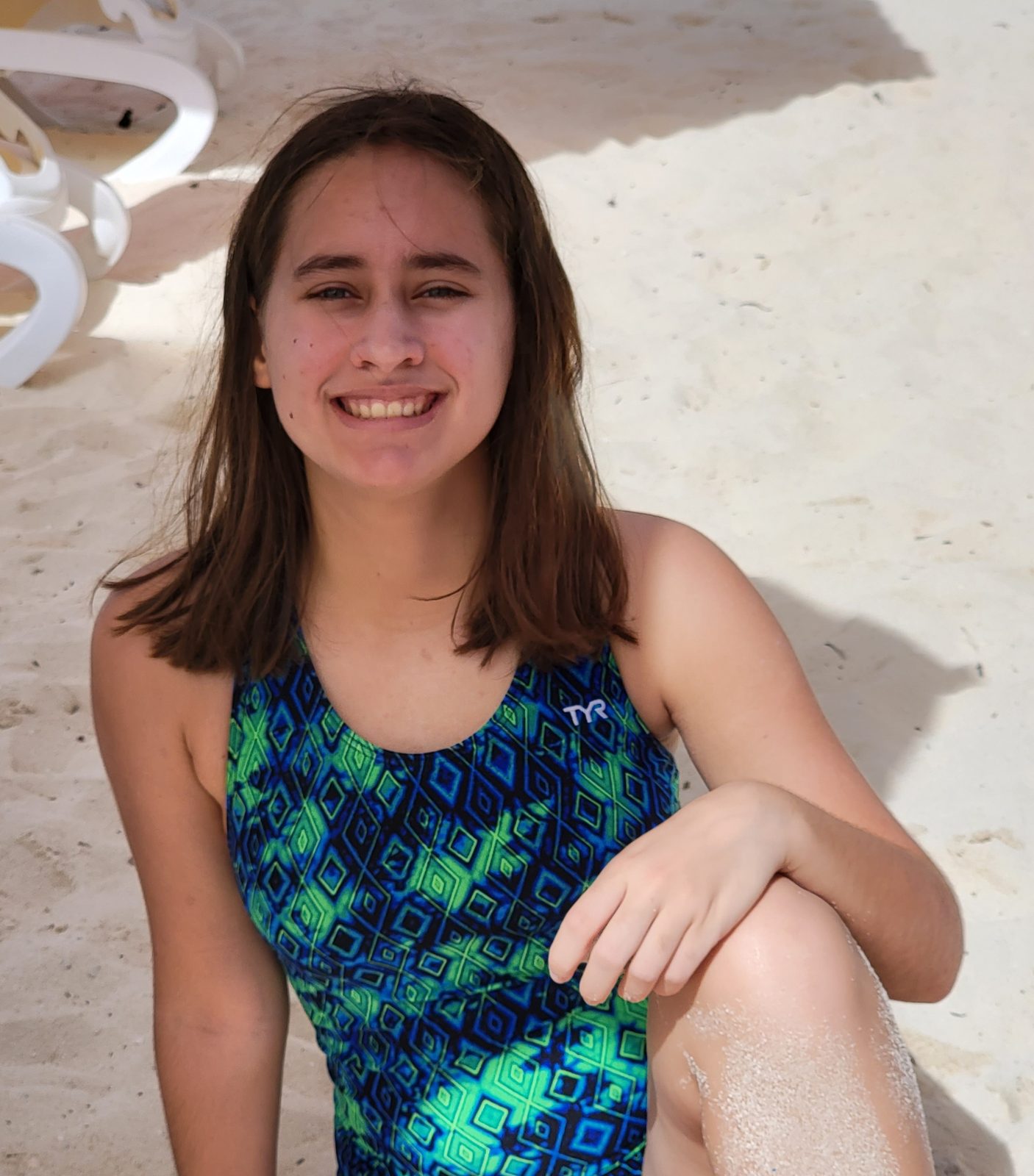 Lisa sitting in the sand