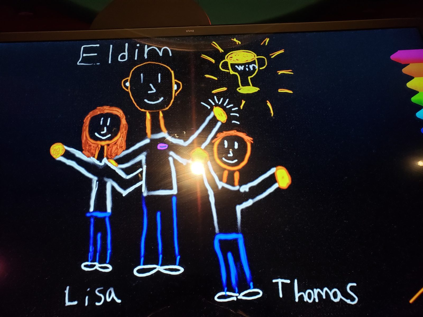 Lisa and Thomas draw with Eldim on the glow wall
