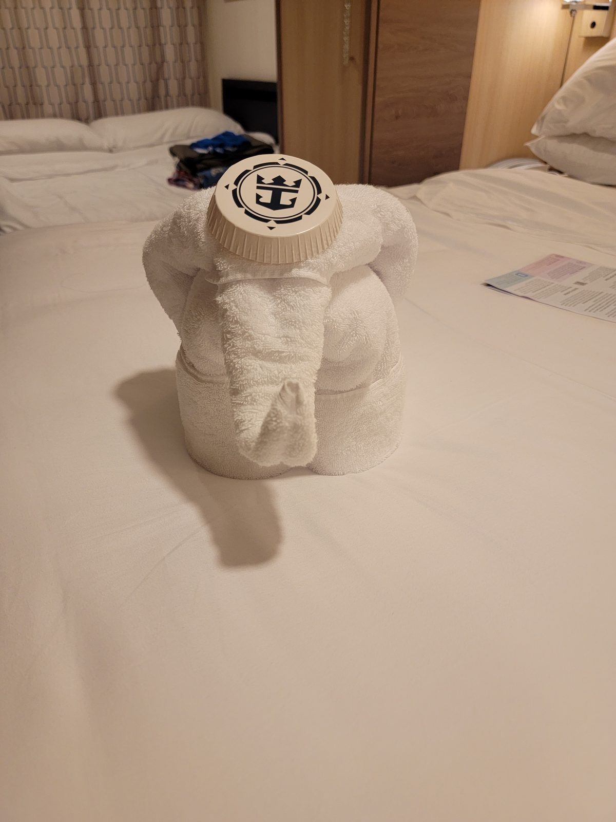 A towel elephant on the bed